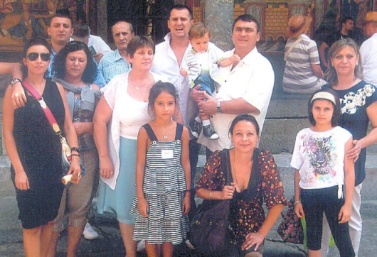 Ив. Муларов с внука на ръце минути след кръщаването в Рилския манастир